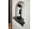 Close up of a vintage telephone in a decorative alcove with an arched entry at 1222 E Almeria Rd, Phoenix, AZ 85006