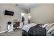 This bedroom features light walls, neutral carpet, closet, and a desk for study or work at 13657 W Paso Trl, Peoria, AZ 85383