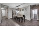 Dining room featuring hard surface floors, decorative furniture, and natural light at 13657 W Paso Trl, Peoria, AZ 85383