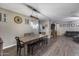 Eat in dining room features decorative furniture, hard surface flooring, and neutral paint at 13657 W Paso Trl, Peoria, AZ 85383