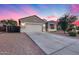 Well-maintained home with a two-car garage and a professionally landscaped front yard at 13657 W Paso Trl, Peoria, AZ 85383