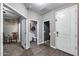 Hallway leads to a full bathroom and a bedroom, showcasing the home's layout and flow at 13657 W Paso Trl, Peoria, AZ 85383