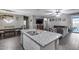 Open concept kitchen features granite counters, stainless steel faucet, and connecting living spaces at 13657 W Paso Trl, Peoria, AZ 85383