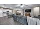 Open concept home design with connecting kitchen, eat in dining, and tv entertainment space at 13657 W Paso Trl, Peoria, AZ 85383