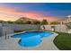Inviting backyard with a pristine pool, landscaped greenery, and picturesque mountain views at 1414 E Cathedral Rock Dr, Phoenix, AZ 85048