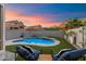 Relaxing backyard with a sparkling pool, comfortable lounge chairs, and desert views at 1414 E Cathedral Rock Dr, Phoenix, AZ 85048