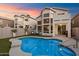 Outdoor oasis featuring a sparkling pool, well-maintained lawn, and ample space for entertaining at 1414 E Cathedral Rock Dr, Phoenix, AZ 85048