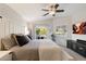 Large bedroom features vaulted ceilings, a ceiling fan, and a sliding glass door to the patio at 1414 E Cathedral Rock Dr, Phoenix, AZ 85048