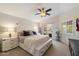 Bright bedroom features a king bed, ceiling fan, and sliding glass doors to the patio at 1414 E Cathedral Rock Dr, Phoenix, AZ 85048