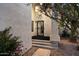 Inviting entryway with a modern black metal screen door and textured stucco exterior for added curb appeal at 1414 E Cathedral Rock Dr, Phoenix, AZ 85048