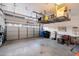 Spacious two-car garage featuring overhead storage racks and ample room at 1414 E Cathedral Rock Dr, Phoenix, AZ 85048