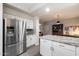 Bright kitchen features stainless appliances, granite counters, and white cabinets for storage at 1414 E Cathedral Rock Dr, Phoenix, AZ 85048