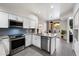 Modern kitchen features stainless steel appliances, white cabinets, and granite countertops at 1414 E Cathedral Rock Dr, Phoenix, AZ 85048