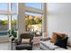 Bright living room with floor to ceiling windows providing beautiful views of mountains and foliage at 1414 E Cathedral Rock Dr, Phoenix, AZ 85048