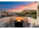 Relaxing patio area with comfortable seating and a cozy fire pit with mountain views at 1414 E Cathedral Rock Dr, Phoenix, AZ 85048