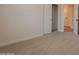Bright bedroom featuring closet and hall access, perfect for ample storage at 14771 W Columbus Ave, Goodyear, AZ 85395