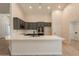 Modern kitchen with gray cabinets, quartz countertops, and stainless steel appliances at 14771 W Columbus Ave, Goodyear, AZ 85395