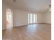 Bright living area with new luxury vinyl flooring, french doors, and seamless flow to other living spaces at 14771 W Columbus Ave, Goodyear, AZ 85395