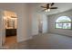 Spacious main bedroom with ensuite bathroom featuring double sinks and natural light at 14771 W Columbus Ave, Goodyear, AZ 85395