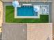 Aerial view of a modern pool, fire pit, and outdoor living space in a well-landscaped backyard at 16417 W Fawn Dr, Goodyear, AZ 85338