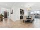 Elegant dining room with a built-in cabinet, chandelier and sliding glass doors to the backyard at 16417 W Fawn Dr, Goodyear, AZ 85338