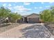 Charming single-story home with a brick driveway and a well-maintained front yard at 16417 W Fawn Dr, Goodyear, AZ 85338