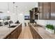 Modern kitchen with granite countertops, a center island, stainless steel appliances, and lots of counter space at 16417 W Fawn Dr, Goodyear, AZ 85338