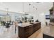 Spacious kitchen featuring a large center island, granite countertops and stainless steel appliances at 16417 W Fawn Dr, Goodyear, AZ 85338