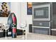 Close-up of built-in stainless steel oven and microwave with wine glasses and a bottle of wine in the foreground at 16417 W Fawn Dr, Goodyear, AZ 85338