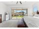 Bright main bedroom featuring sliding glass doors to the backyard, and views of the pool and desert at 16417 W Fawn Dr, Goodyear, AZ 85338