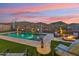Inviting backyard with pool, fire pit, and desert views, perfect for outdoor entertaining at 16417 W Fawn Dr, Goodyear, AZ 85338