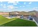 Inviting pool area with a fire pit and comfortable seating, perfect for outdoor relaxation at 16417 W Fawn Dr, Goodyear, AZ 85338