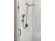 Close up of a glass shower featuring two shower heads and neutral tile at 16417 W Fawn Dr, Goodyear, AZ 85338
