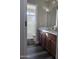 Bathroom features a dual sink vanity and a shower-tub combination, providing functionality and modern comfort at 17344 W Adams St, Goodyear, AZ 85338