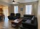 Living room featuring a sliding glass door, comfortable seating, and luxury vinyl plank flooring at 17344 W Adams St, Goodyear, AZ 85338