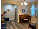 Inviting space showcases a traditional piano, natural light, and a warm ambiance perfect for relaxing or entertaining at 17344 W Adams St, Goodyear, AZ 85338