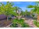 Picturesque backyard featuring a charming fountain and lush greenery, creating a tranquil outdoor oasis at 1768 E Grand Ridge Rd, Queen Creek, AZ 85140