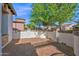 Spacious backyard with brick-paved patio and white privacy wall perfect for entertaining at 1768 E Grand Ridge Rd, Queen Creek, AZ 85140