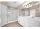 Bathroom with a shower, double sink vanity, and large mirror at 1768 E Grand Ridge Rd, Queen Creek, AZ 85140