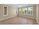Bedroom with three windows, shutters, and tile floors at 1768 E Grand Ridge Rd, Queen Creek, AZ 85140