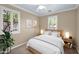 Comfortable bedroom with a ceiling fan, natural light, and neutral wall art at 1768 E Grand Ridge Rd, Queen Creek, AZ 85140