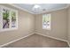 Cozy bedroom with natural light and tile flooring at 1768 E Grand Ridge Rd, Queen Creek, AZ 85140