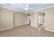 Large Primary bedroom with tile flooring, neutral walls, ceiling fan and white trim at 1768 E Grand Ridge Rd, Queen Creek, AZ 85140