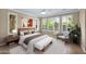 Cozy bedroom featuring large windows, neutral decor, and a comfortable king-size bed at 1768 E Grand Ridge Rd, Queen Creek, AZ 85140