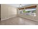 Bright, empty bedroom with tile floors and two windows at 1768 E Grand Ridge Rd, Queen Creek, AZ 85140