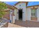 Inviting entrance with brick accents, pergola, and pavers leading to the front door at 1768 E Grand Ridge Rd, Queen Creek, AZ 85140
