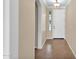 Bright hallway with tile flooring, arched doorway, and a view of the white front door at 1768 E Grand Ridge Rd, Queen Creek, AZ 85140