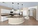 Spacious kitchen with a large island, white cabinets, granite countertops, and stainless steel appliances at 1768 E Grand Ridge Rd, Queen Creek, AZ 85140