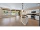 Open-concept kitchen featuring granite countertops, stainless steel appliances, and a view to the living area at 1768 E Grand Ridge Rd, Queen Creek, AZ 85140