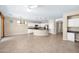 Open-concept living area showcases a kitchen with white cabinetry and a large island with bar seating at 1768 E Grand Ridge Rd, Queen Creek, AZ 85140